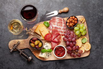 Cheese, meat, grapes and olives antipasto