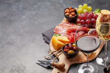 Cheese, meat, grapes and olives antipasto