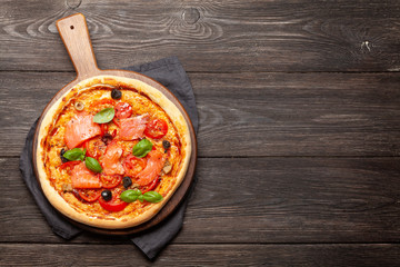 Tasty homemade pizza with salmon