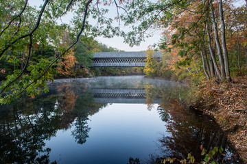 Old covered bridge in new england fall