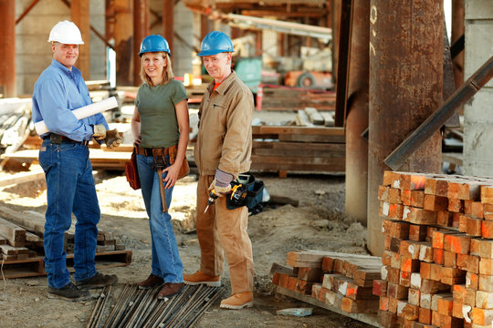 group of construction workers looking at camera on construction site