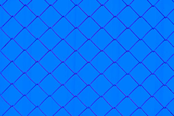 chain link fence with blue wall