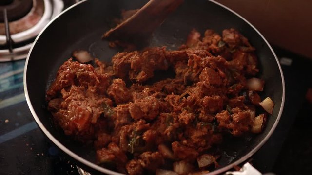 South Indian dish spicy beef fry Kerala, India. side dish ghee rice, appam, parotta, puttu, bread and chappathi, Kerala cuisine ,Buffalo roast / Meat pepper fry with coconut. India spices cooking,