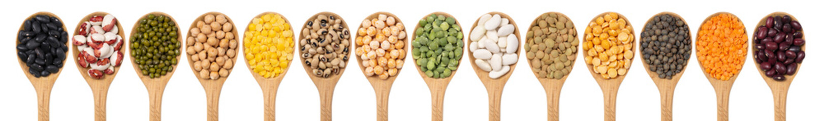 Collection of legumes in wooden spoons on a white background top view. An isolated set of beans, lentils, peas, mung bean, chickpeas.