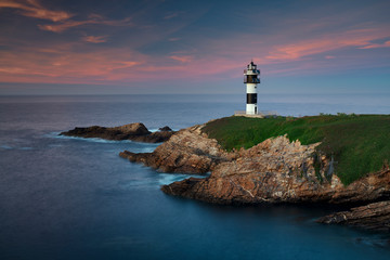 Lighthouse at sunset in Galicia