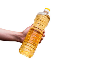 Sunflower oil in hand. A bottle of sunflower oil.