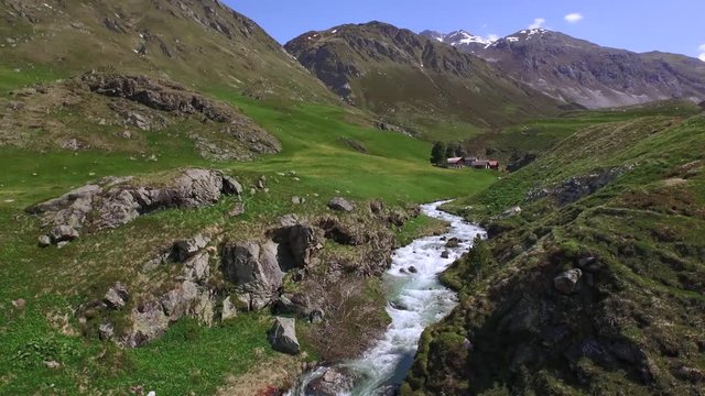 SURSES, SWITZERLAND - DECEMBER 14, 2015: Drone flight above the mountain creek in the valley Oberhalbstein under Julierpass.