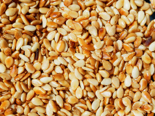 Sesame. Culinary background. Fried sesame seeds close-up.