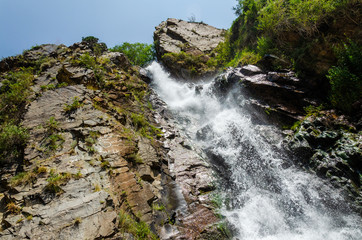 Rocky mountains waterfall in the afternoon short exposure flash