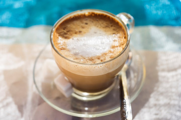 White coffee cappuccino in morning sun, Morocco 