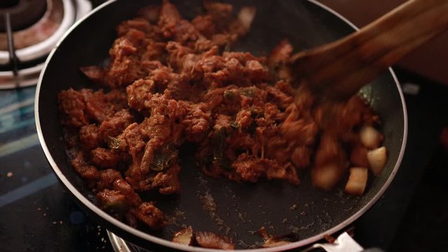 South Indian dish spicy beef fry Kerala, India. side dish ghee rice, appam, parotta, puttu, bread and chappathi, Kerala cuisine ,Buffalo roast / Meat pepper fry with coconut. India spices cooking,