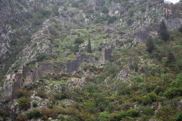 Fototapeta na wymiar Part of the old fortress wall in the mountains in Kotor, Montenegro