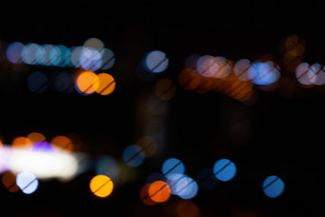 Bokeh city lights in black background. Color overlay light pattern.