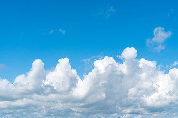 Blue sky background with white clouds, texture