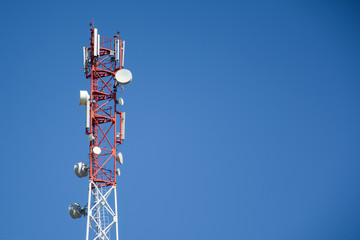 Base Station Telecommunication tower. Wireless Communication Antenna Transmitter on blue background...