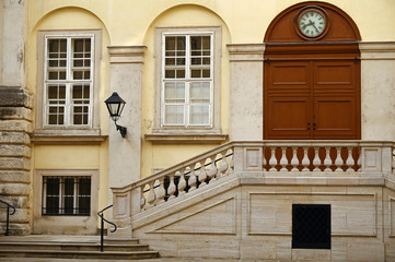 Old building with stairway and clock detail in Vienna Austria
