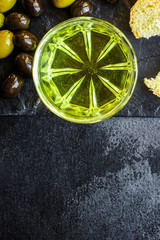 olive oil appetizer olives, cold pressed, 
menu concept food background. top view. copy spaces for text for text keto or paleo diet