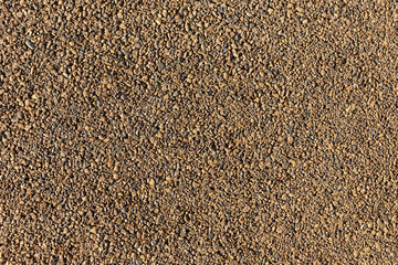 Gravel pavement texture. Sidewalk made of fine stone. Abstract texture stone background.