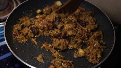 South Indian dish spicy beef fry Kerala, India. side dish ghee rice, appam, parotta, puttu, bread and chappathi, Kerala cuisine ,Buffalo roast / Meat pepper fry with coconut. India spices cooking,