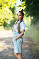 Girl with a silly facial expression, in nature. 