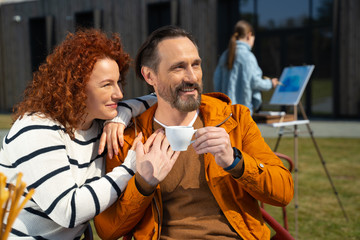 Joyful husband and wife spending time together outdoors