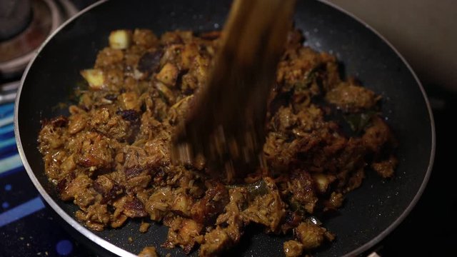 South Indian dish spicy beef fry Kerala, India. side dish ghee rice, appam, parotta, puttu, bread and chappathi, Kerala cuisine ,Buffalo roast / Meat pepper fry with coconut. India spices cooking,