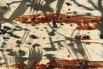 abstract grunge background, artistic painting with black paint on a light wooden background, abstract strokes and spots in a chaotic style