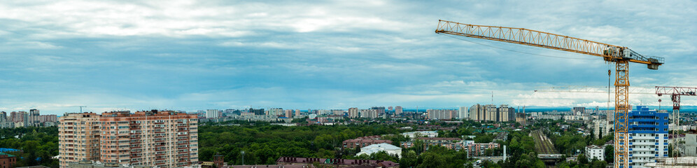 Fototapeta na wymiar Construction tower crane on the background of the city