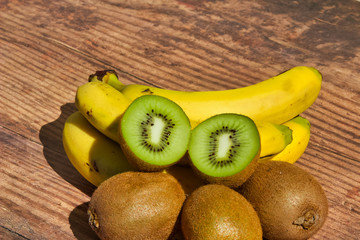 Three bananas and four kiwi fruit, healthy and delicious tropical fruit full of vitamins for a...