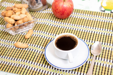 cup of expresso coffee with peanuts and fruit