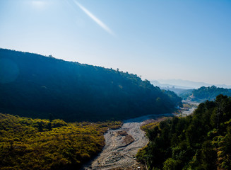 Scenic Aerial Scene - River between two mountains of himalayas, aerial view, crystal clear water
