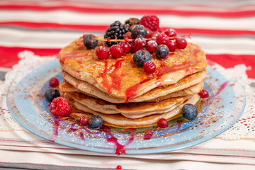 oats and banana pancakes with berries