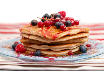 oats and banana pancakes with berries