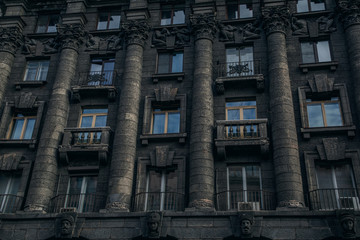 View of the beautiful facade of a black house. Houses of St. Petersburg.Windows of a big city.Patterns.