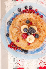 oats and banana pancakes with berries