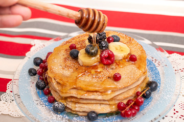 oats and banana pancakes with berries