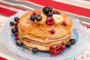 oats and banana pancakes with berries