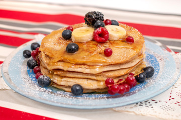 oats and banana pancakes with berries