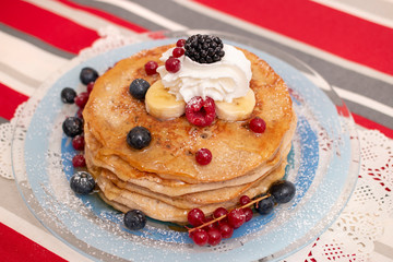 oats and banana pancakes with berries