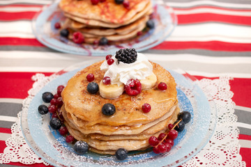 oats and banana pancakes with berries