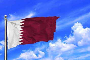 Qatar National Flag Waving In The Wind On A Beautiful Summer Blue Sky