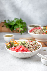 Healthy raw tuna bowl with quinoa and vegetales. Buddha bowl