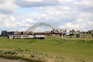 Steel suspension bridge over river Noord at Hendrik Ido Ambacht for road N915