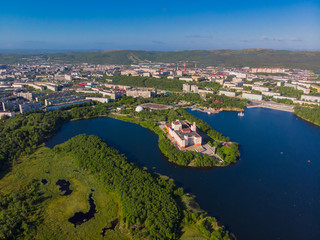 Murmansk, Russia - July 1, 2019: Aerial view panorama of city holiday park with Semonovskoye lake