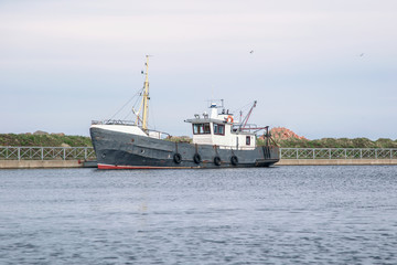 Fishing ship on the pier of Lake Ladoga. Leningrad region of Russia.