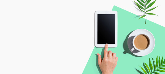 Person using a tablet computer from above