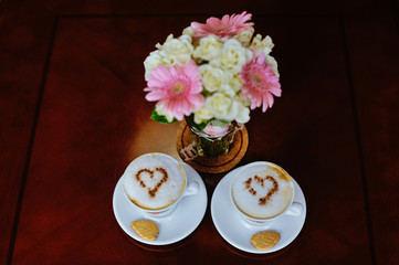 Wedding bouquet with a cup of coffee