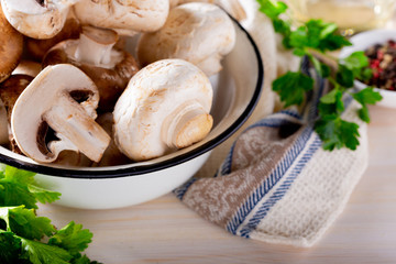 Champignon mushrooms and spices on a wooden table. Cooking concept