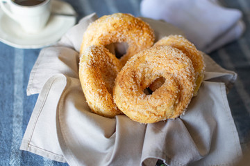 cookies in a fabric napkin with a cup of coffee behind