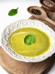Plate of asparagus soup in knolling concept on white background.